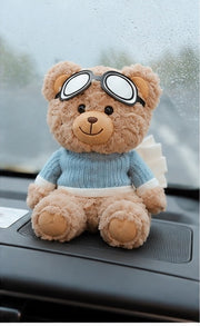 Teddy bear car accessory held in hand